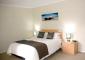 Master Bedroom in a 2 bed apartment - Beachside Apartment Hotel