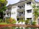 Citysider Cairns - building with gardens in pool area - Citysider Holiday Apartments
