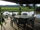 Dining on the expansive undercover timber deck overlooking the Daintree River - Daintree Riverview Lodges