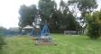 grassed area showing swings,BBQ and pool - Glenndale Park Motel
