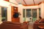 lounge area overlooking forest - Harmony Forest Cottages
