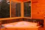 Relaxing in spa overlooking forest - Harmony Forest Cottages