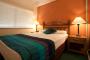 Air conditioned bedroom - Mid City Luxury Suites